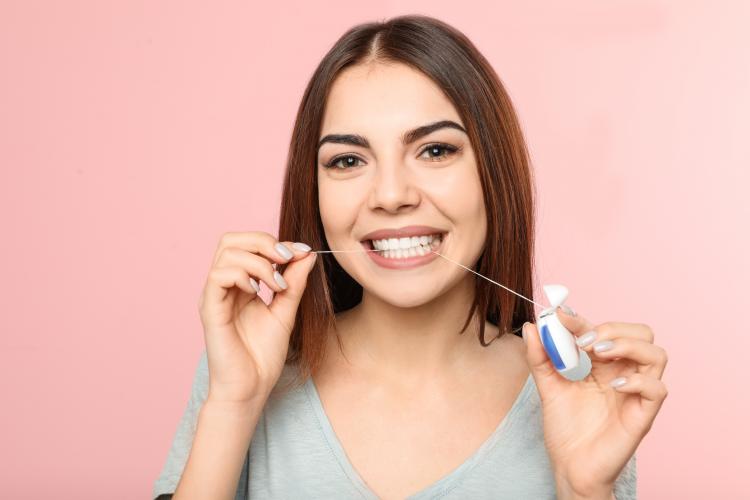 Flossing Daily Can Protect Your Smile