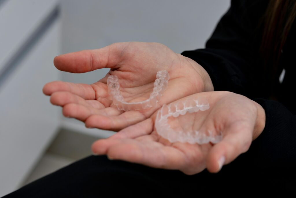 Logan dentist holding clear aligners